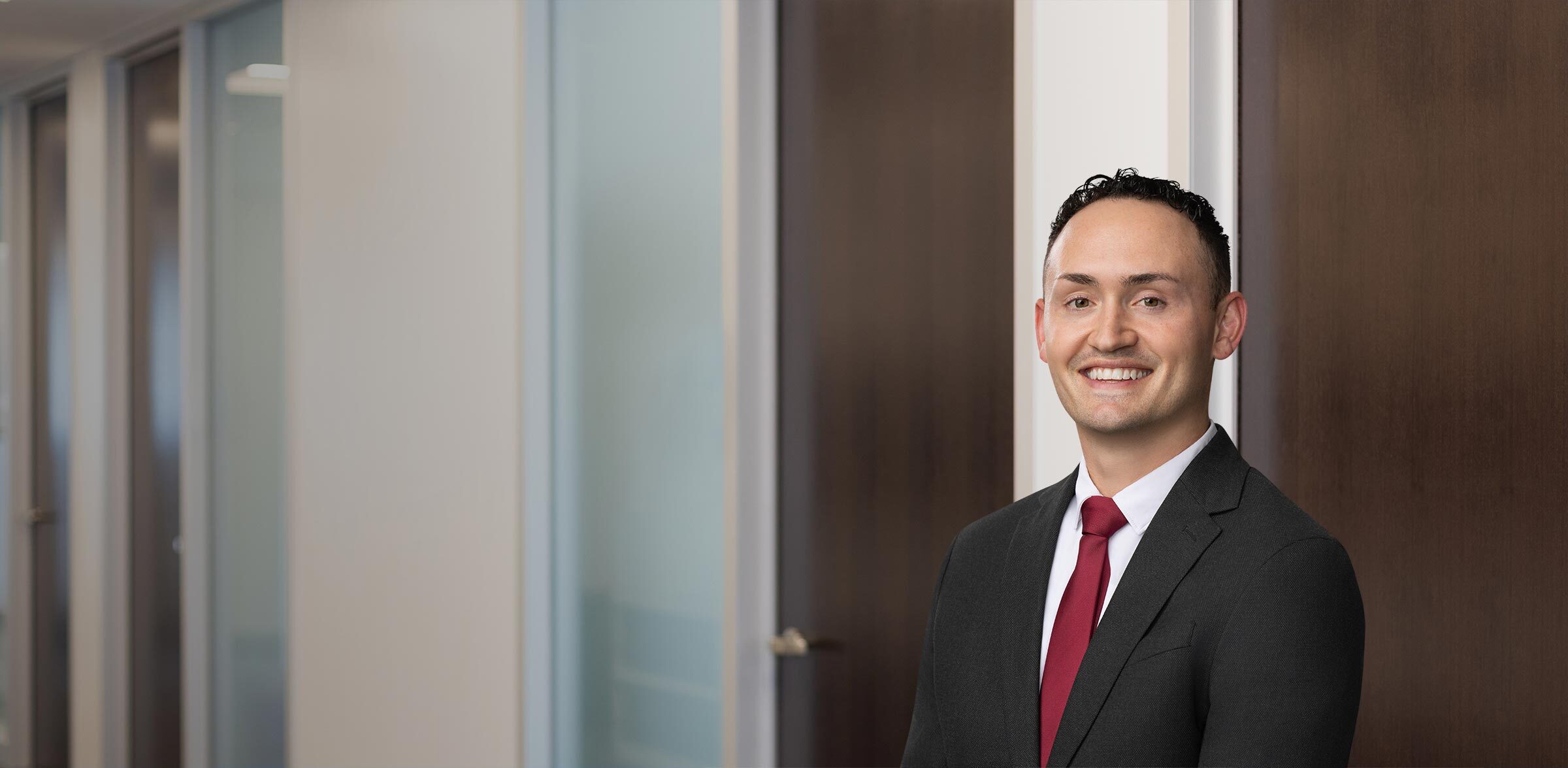 Travis Poulos, Quarles & Brady LLP Photo